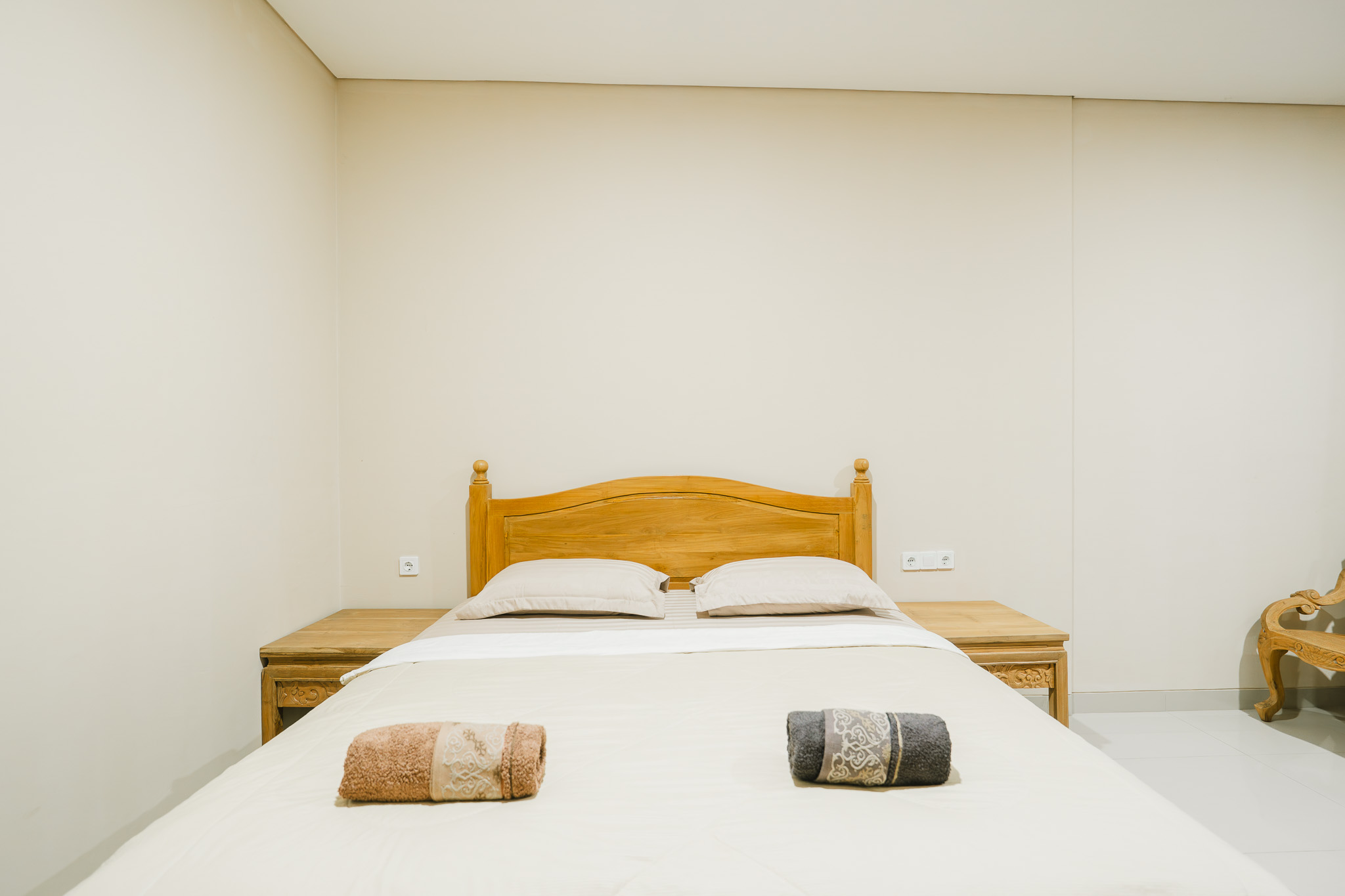 Superior Double Room — queen bed with crisp linen and terracotta accents — photo 3 of 8